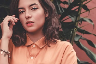 a woman with an orange top